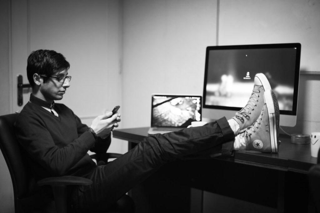 Person's Feet on Desk