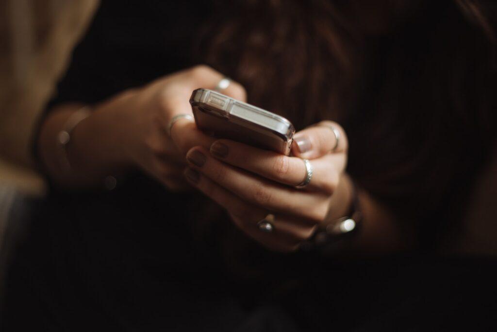 person using smartphone to shop